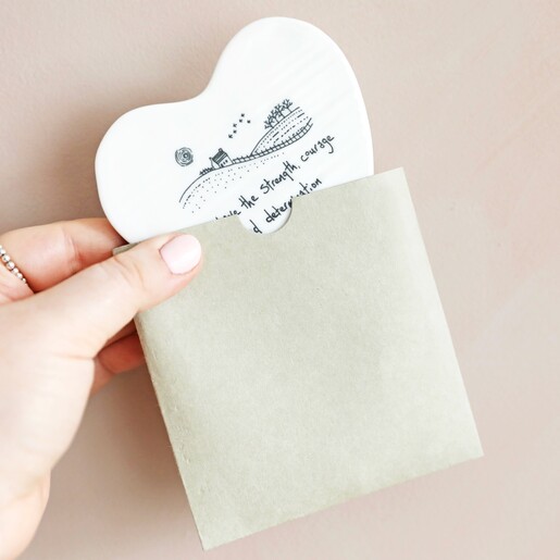 Model Holds East of India Strength Quote Porcelain Heart Coaster in Packaging