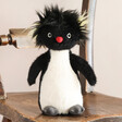 Jellycat Ronnie Rockhopper Penguin Soft Toy on Wooden Chair