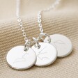 Close Up of Silver Personalised Family Constellation Disc Charm Necklace With Three Small Silver Pendants