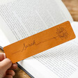 Model Holding Personalised Name & Birth Flower Leather Bookmark