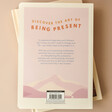 Back Cover of How To Be Present Book on Neutral Background