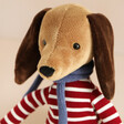 Close Up of Jellycat Beatnik Buddy Sausage Dog Soft Toy Against Neutral Background
