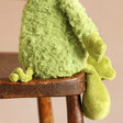 Close Up of Jellycat Grizzo Gremlin Soft Toy Legs Sat on Chair