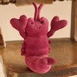 Jellycat Love-Me Lobster Soft Toy on Wooden Chair