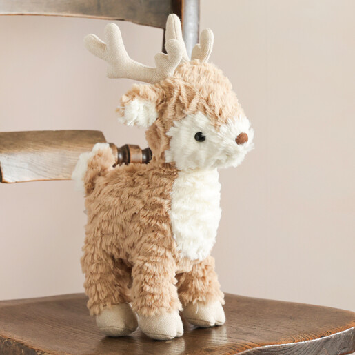 Jellycat Mitzi Reindeer Soft Toy Standing on Chair