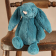 Jellycat Small Bashful Mineral Blue Bunny Soft Toy on Wooden Chair