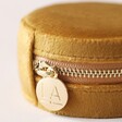 Close Up of Zip on Side of Mustard Velvet Round Travel Jewellery Case