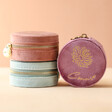 Personalised Birth Flower Velvet Round Travel Jewellery Cases Stacked in Front of Neutral Background