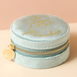 Mint Green Personalised Birth Flower Velvet Round Travel Jewellery Case in Front of Neutral Background