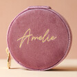 Mauve Pink Personalised Velvet Round Travel Jewellery Case in Front of Neutral Background