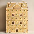 Wooden Gingerbread House LED Advent Calendar With Cut-Out Inserted on Neutral Background