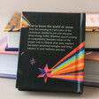 Back Cover of Auras: An Introduction to Energy Fields Book Up Against a Stack of Books