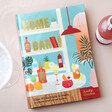 Home Bar Cocktail Recipe Book  on Neutral Background with Bottle of Drink