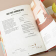Home Bar Cocktail Recipe Book Open on Hot Hot Chocolate Recipe