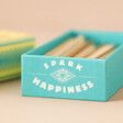 Close Up of Logo on Box of Matchbox Spark Happiness Prompts