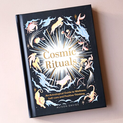 Front Cover of Cosmic Rituals Book on Beige Background