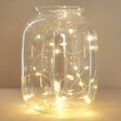 30 Battery Powered LED Gold Wire String Lights in glass jar on wooden table