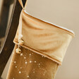 Close Up of Top and Bells on the Large Starry Gold Velvet Christmas Stocking