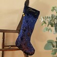 Navy Blue Personalised Constellation Starry Velvet Christmas Stocking Hanging on Chair