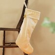 Cream Personalised Large Starry Velvet Christmas Stocking Hanging from Chair