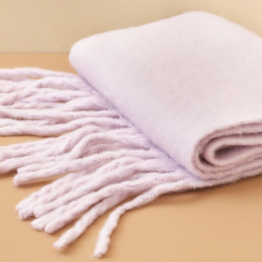 Pastel Lilac Winter Scarf Folded Up on Orange Background