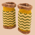 Powder Zig Zag Wrist Warmers Against Neutral Coloured Background