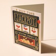 Rifle Paper Co. Hit The Jackpot Greetings Card Standing Up with Beige Background