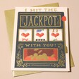 Rifle Paper Co. Hit The Jackpot Greetings Card on Top of Envelope on Neutral Background