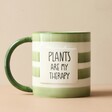 Front of Striped Green and Cream Mug with Plants are my Therapy Text