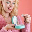 Model Looking Inside Mini Round Travel Jewellery Case in Turquoise