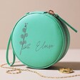 Turquoise Delphinium Personalised Birth Flower Mini Round Travel Jewellery Case on Neutral Background