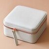 Front of Square Travel Jewellery Box in Grey on Pink Background