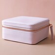Side View of Square Travel Jewellery Box in Lilac Pink on Pink Background