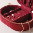 Inside of Personalised Starry Night Velvet Oval Jewellery Case in Red Filled With Gold Jewellery