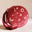 Starry Night Velvet Mini Round Jewellery Case in Red Standing Upright on Pink Surface