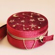 Starry Night Velvet Mini Round Jewellery Case in Red Lying Flat on Pink Surface