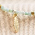Close Up of Feather Charm on Amazonite Stone Bracelet with Feather Charm in Gold