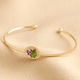February Pressed Birth Flower Bangle in Gold on Beige Coloured Fabric