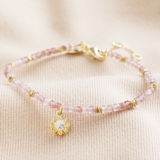 Strawberry Quartz Stone Bracelet with Daisy Charm in Gold on Cream Fabric