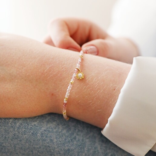 Model Wearing Strawberry Quartz Stone Bracelet with Daisy Charm in Gold