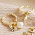 Daisy, Pearl and Feather Hoop Earrings in Gold with Feather Charm on One Hoop and One Daisy and Pearl on Another 