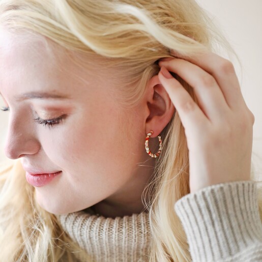 Model Wearing Red, White and Pink Twisted Enamel Hoop Earrings in Gold