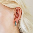 Close Up of Model Wearing Starry Blue Enamel Hoop Earrings