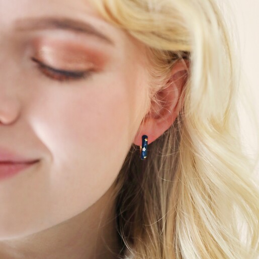 Close Up of Starry Navy Enamel Hoop Earrings on Model