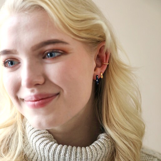 Model Wearing Starry Navy Enamel Hoop Earrings with Natural Background