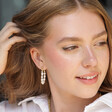 Model Wears Freshwater Pearl Loop Earrings in Gold