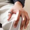 Model Wearing Men's Stainless Steel Molten Band Ring on His Thumb