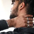 Model Wearing Men's Textured Leaf Stainless Steel Ring With Other Jewellery