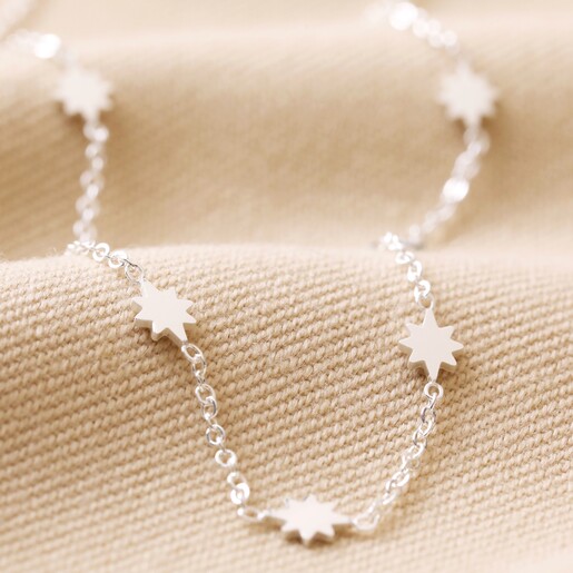 Close Up of Detail on Long Starry Necklace in Silver