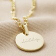 Close Up of Gold Disc Pendant With Clean Engraving and LA Pen Script Font